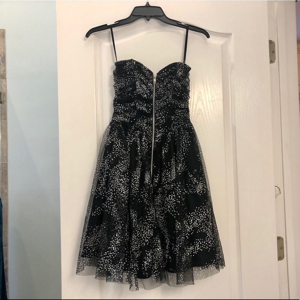Strapless black mini dress with silver sparks